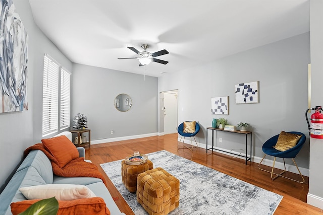 29 51st St Unit A2, Weehawken, NJ 07086 - living area featuring a ceiling fan, wood finished floors, and baseboards