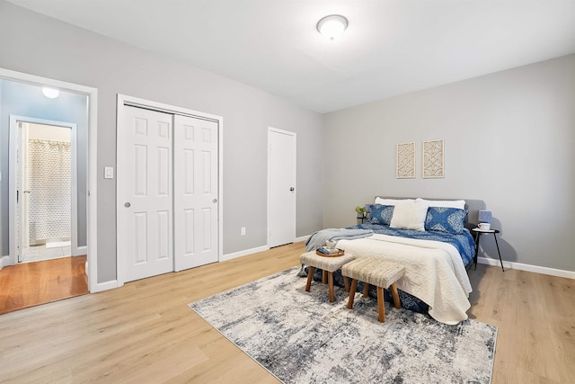 29 51st St Unit A2, Weehawken, NJ 07086 - bedroom featuring light wood-type flooring, baseboards, and a closet