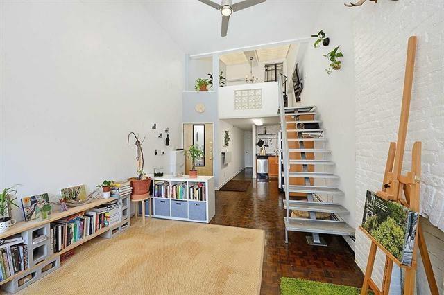 interior space featuring parquet floors and a high ceiling