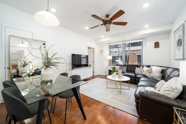 living area with ceiling fan, hardwood / wood-style floors, and recessed lighting