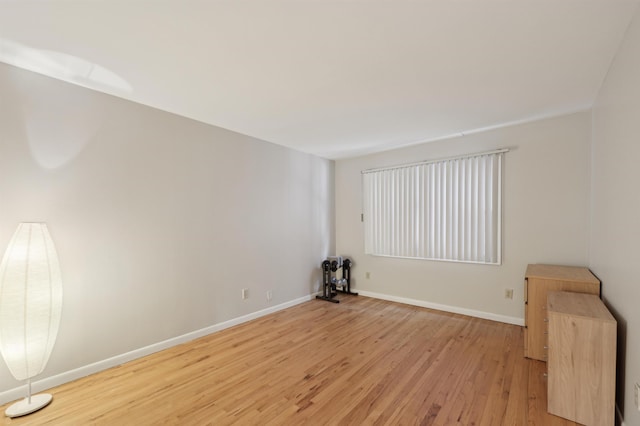 empty room with light hardwood / wood-style floors