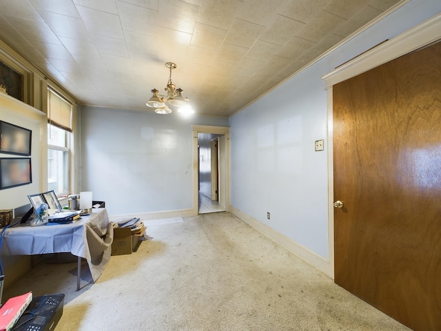 interior space with a chandelier, light carpet, and crown molding