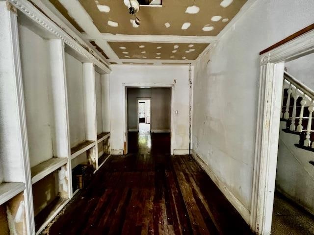 hall featuring coffered ceiling and dark hardwood / wood-style floors