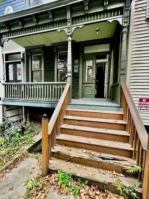 doorway to property with covered porch