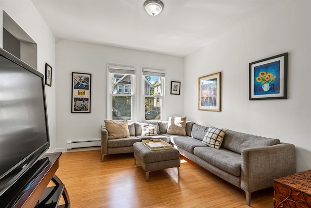 living room featuring light hardwood / wood-style floors and a baseboard radiator