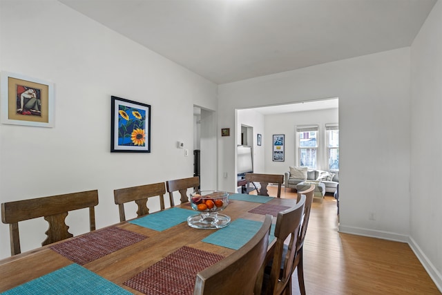 dining area with light hardwood / wood-style flooring