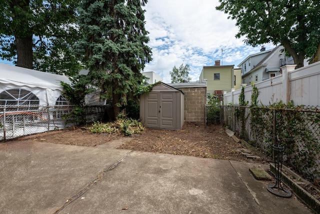 71 W 17th St, Bayonne, NJ 07002 - fenced backyard with a shed and a patio area