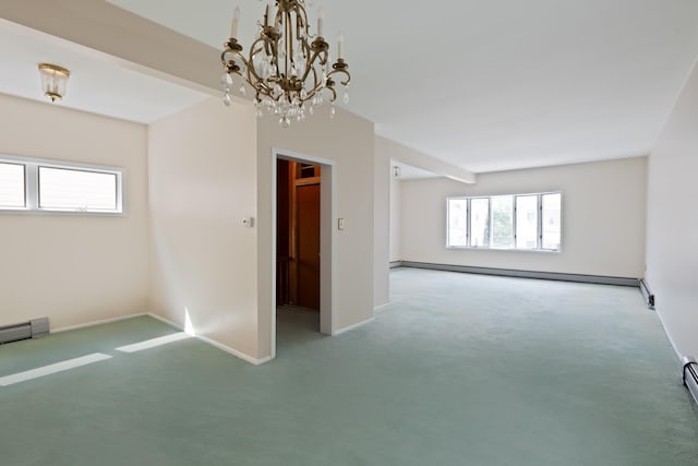 71 W 17th St, Bayonne, NJ 07002 - unfurnished room featuring a baseboard radiator, carpet, and a chandelier