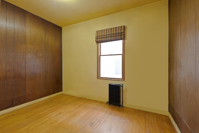 71 W 17th St, Bayonne, NJ 07002 - unfurnished room featuring radiator and light wood finished floors