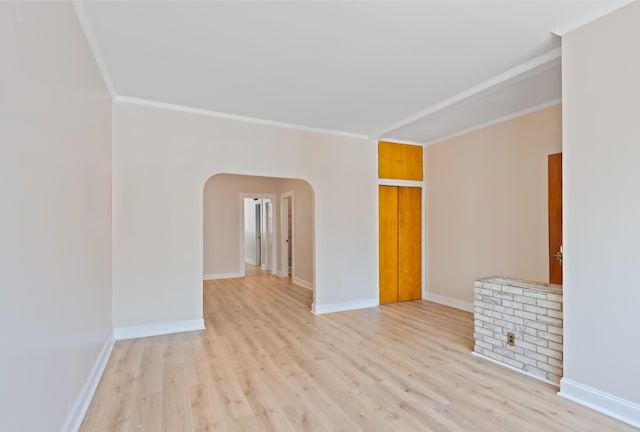 71 W 17th St, Bayonne, NJ 07002 - spare room with arched walkways, light wood-type flooring, and crown molding