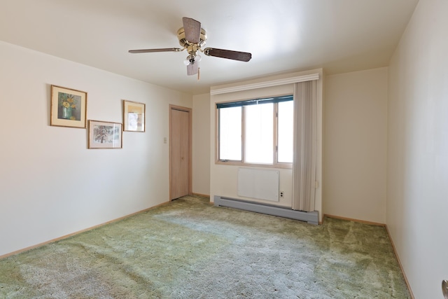 71 W 17th St, Bayonne, NJ 07002 - unfurnished room featuring a baseboard heating unit, carpet, and a ceiling fan