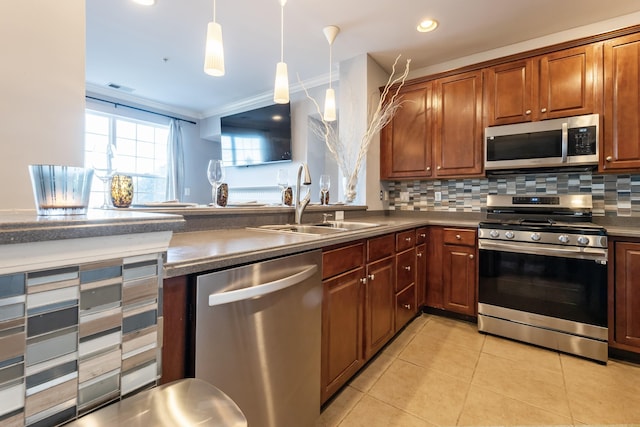 kitchen with light tile patterned flooring, pendant lighting, sink, decorative backsplash, and stainless steel appliances