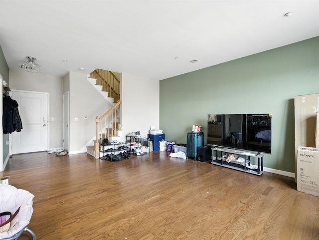 1201 Summit Ave Unit 402, Jersey City, NJ 07307 - living area with stairs and wood finished floors
