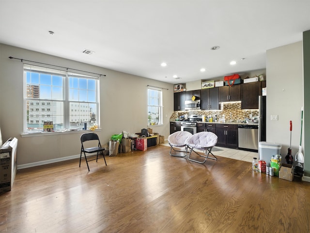 1201 Summit Ave Unit 402, Jersey City, NJ 07307 - living area with light wood finished floors and recessed lighting