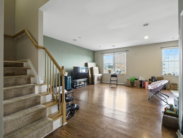 1201 Summit Ave Unit 402, Jersey City, NJ 07307 - living room with stairway, wood finished floors, and recessed lighting