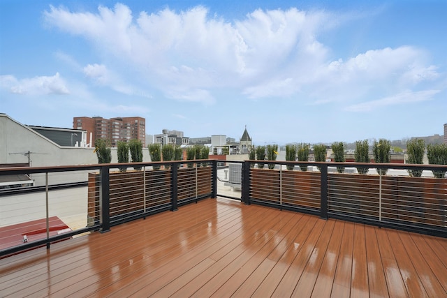 wooden terrace with a city view