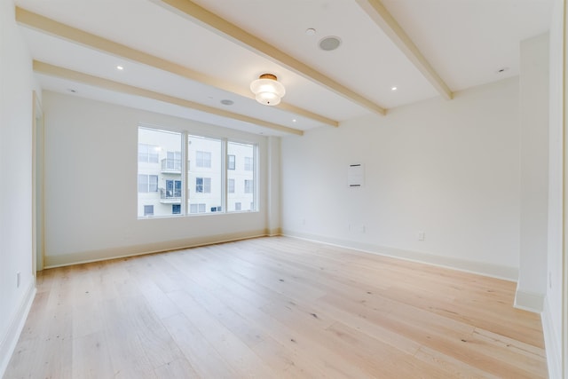 unfurnished room with beamed ceiling, baseboards, light wood finished floors, and recessed lighting