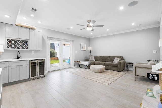 23 Manhattan Ave Unit 1, Jersey City, NJ 07307 - living area featuring beverage cooler, wet bar, a ceiling fan, ornamental molding, and recessed lighting