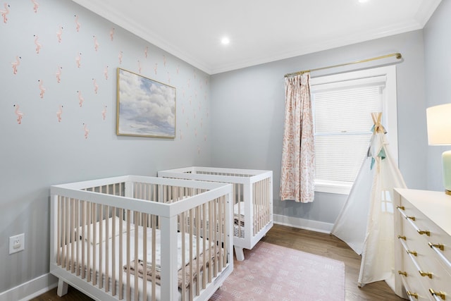 23 Manhattan Ave Unit 1, Jersey City, NJ 07307 - bedroom featuring ornamental molding, wood finished floors, a nursery area, baseboards, and recessed lighting
