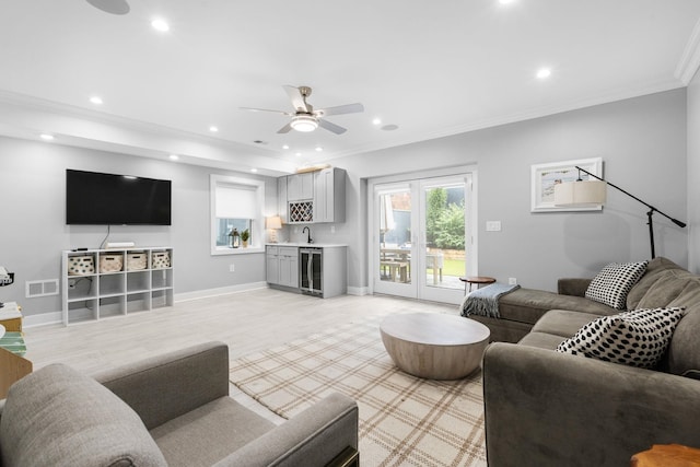 23 Manhattan Ave Unit 1, Jersey City, NJ 07307 - living area with bar with sink, crown molding, a ceiling fan, recessed lighting, and beverage cooler