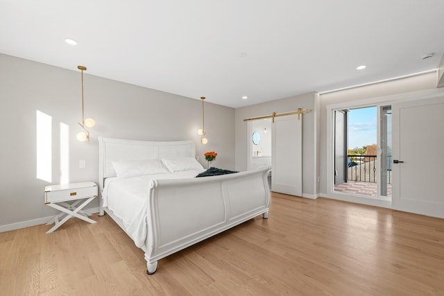 312 Garfield Ave Unit 2, Jersey City, NJ 07305 - bedroom featuring access to outside, light wood-style floors, a barn door, and recessed lighting