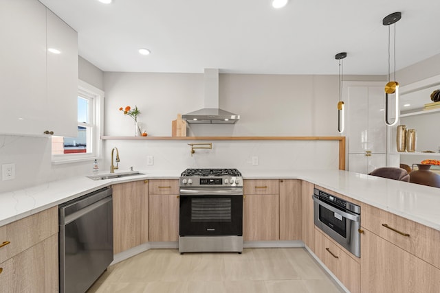 312 Garfield Ave Unit 2, Jersey City, NJ 07305 - kitchen with stainless steel appliances, wall chimney range hood, light brown cabinets, modern cabinets, and light stone countertops