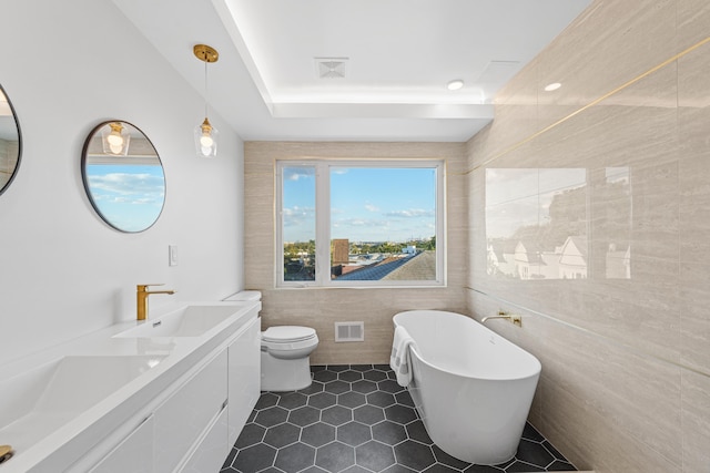 312 Garfield Ave Unit 2, Jersey City, NJ 07305 - full bath with a soaking tub, tile walls, tile patterned floors, double vanity, and a raised ceiling