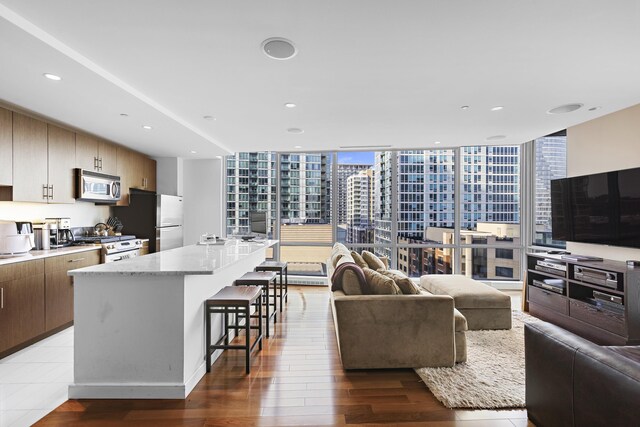 20 Newport Pkwy Unit 1108, Jersey City, NJ 07310 - living area with recessed lighting, wood finished floors, and a wall of windows
