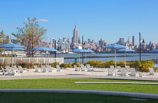 20 Newport Pkwy Unit 1108, Jersey City, NJ 07310 - view of property's community with a view of city, fence, a yard, and a water view