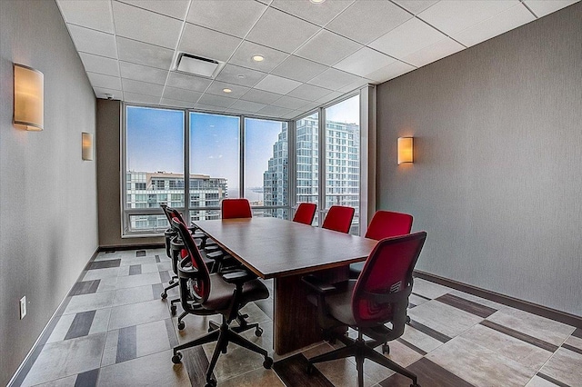 20 Newport Pkwy Unit 1108, Jersey City, NJ 07310 - dining area with floor to ceiling windows, visible vents, a city view, and baseboards