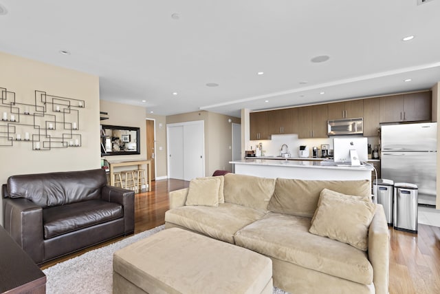 20 Newport Pkwy Unit 1108, Jersey City, NJ 07310 - living area with recessed lighting, light wood finished floors, and baseboards