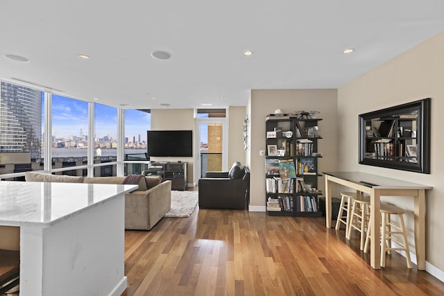 20 Newport Pkwy Unit 1108, Jersey City, NJ 07310 - living room with baseboards, recessed lighting, and light wood finished floors