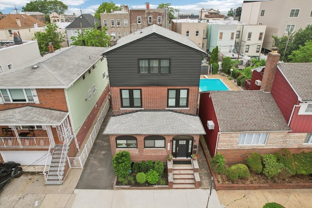 7619 5th Ave, North Bergen, NJ 07047 - view of front of house featuring brick siding, a residential view, stairs, and an attached garage