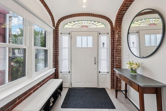 7619 5th Ave, North Bergen, NJ 07047 - entrance foyer featuring light tile patterned flooring and brick wall