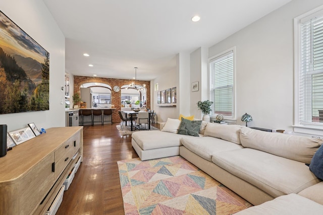 7619 5th Ave, North Bergen, NJ 07047 - living area with a chandelier, plenty of natural light, recessed lighting, wood finished floors, and arched walkways