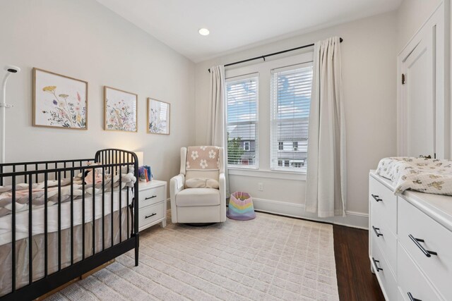7619 5th Ave, North Bergen, NJ 07047 - bedroom featuring a nursery area, wood finished floors, and recessed lighting