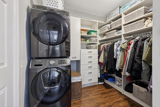 7619 5th Ave, North Bergen, NJ 07047 - washroom featuring stacked washer and clothes dryer and dark wood-type flooring