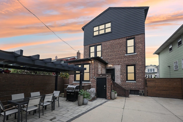 7619 5th Ave, North Bergen, NJ 07047 - back of house featuring brick siding, a pergola, and a patio
