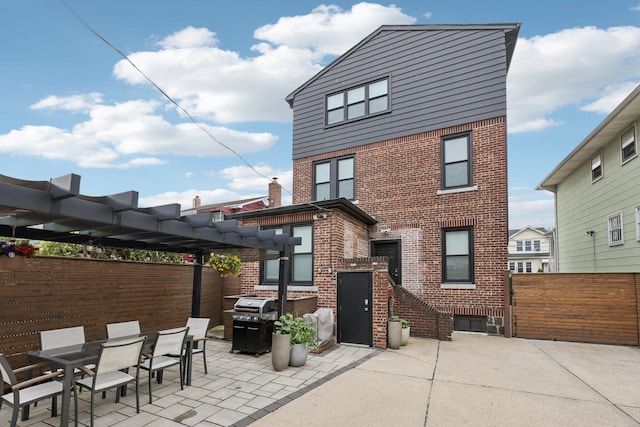 7619 5th Ave, North Bergen, NJ 07047 - back of property with brick siding, a patio area, a pergola, and outdoor dining space