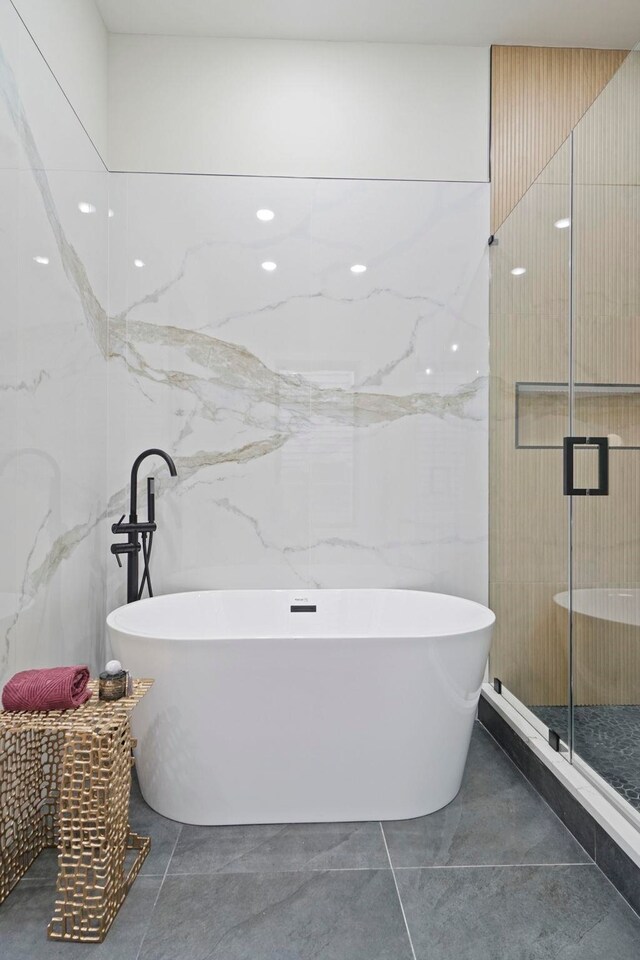 81 Webster Ave Unit 1, Jersey City, NJ 07307 - bathroom featuring a stall shower, tile walls, and a freestanding tub