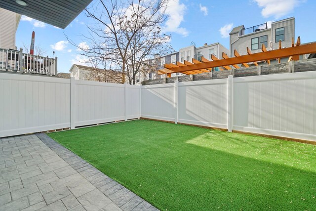 81 Webster Ave Unit 1, Jersey City, NJ 07307 - fenced backyard with a pergola and a patio