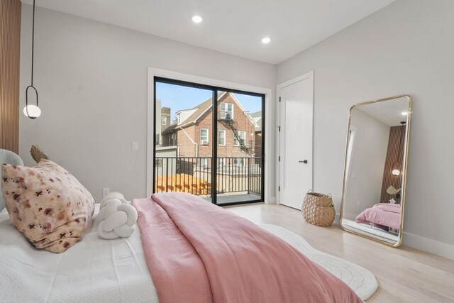 81 Webster Ave Unit 1, Jersey City, NJ 07307 - bedroom with access to exterior, wood finished floors, and recessed lighting