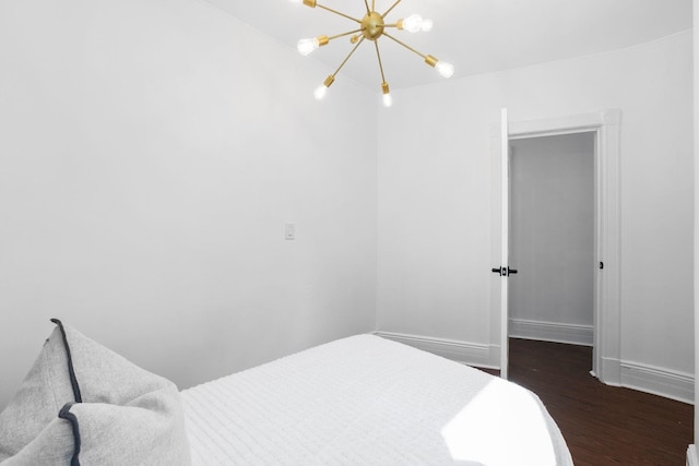 48 Armstrong Ave, Jersey City, NJ 07305 - bedroom with a chandelier and wood finished floors