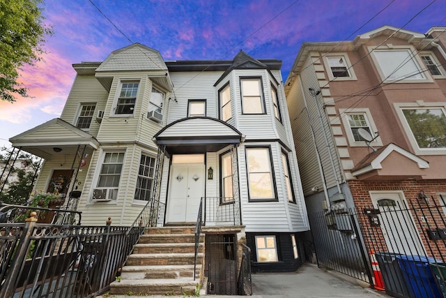 48 Armstrong Ave, Jersey City, NJ 07305 - view of front of property with a fenced front yard, entry steps, a gate, and cooling unit