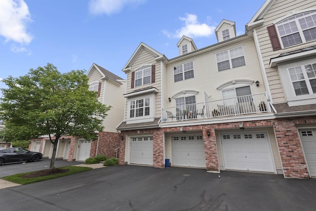 6 Elco Ct, Bayonne, NJ 07002 - townhome / multi-family property featuring driveway, an attached garage, and brick siding