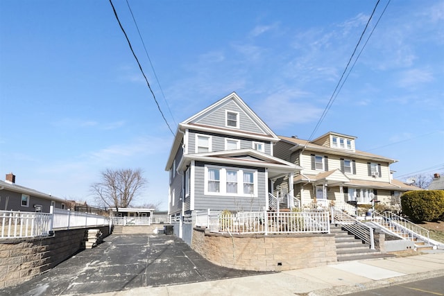 view of front of house featuring fence