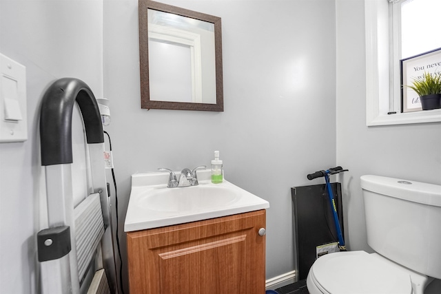 bathroom with toilet and vanity