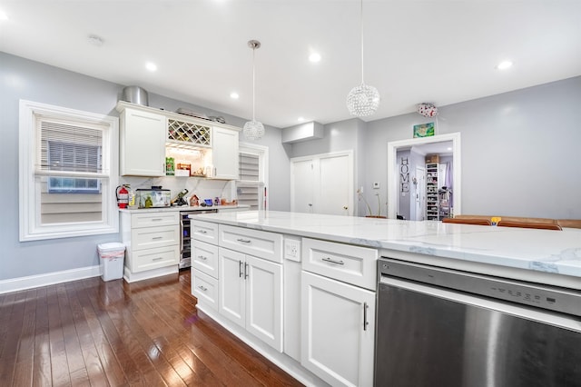 kitchen with dark wood-type flooring, beverage cooler, decorative light fixtures, dishwasher, and white cabinetry