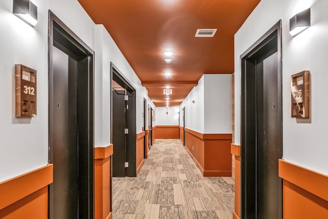 hall with light hardwood / wood-style flooring