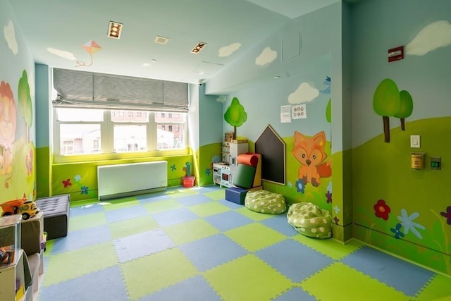 playroom with lofted ceiling